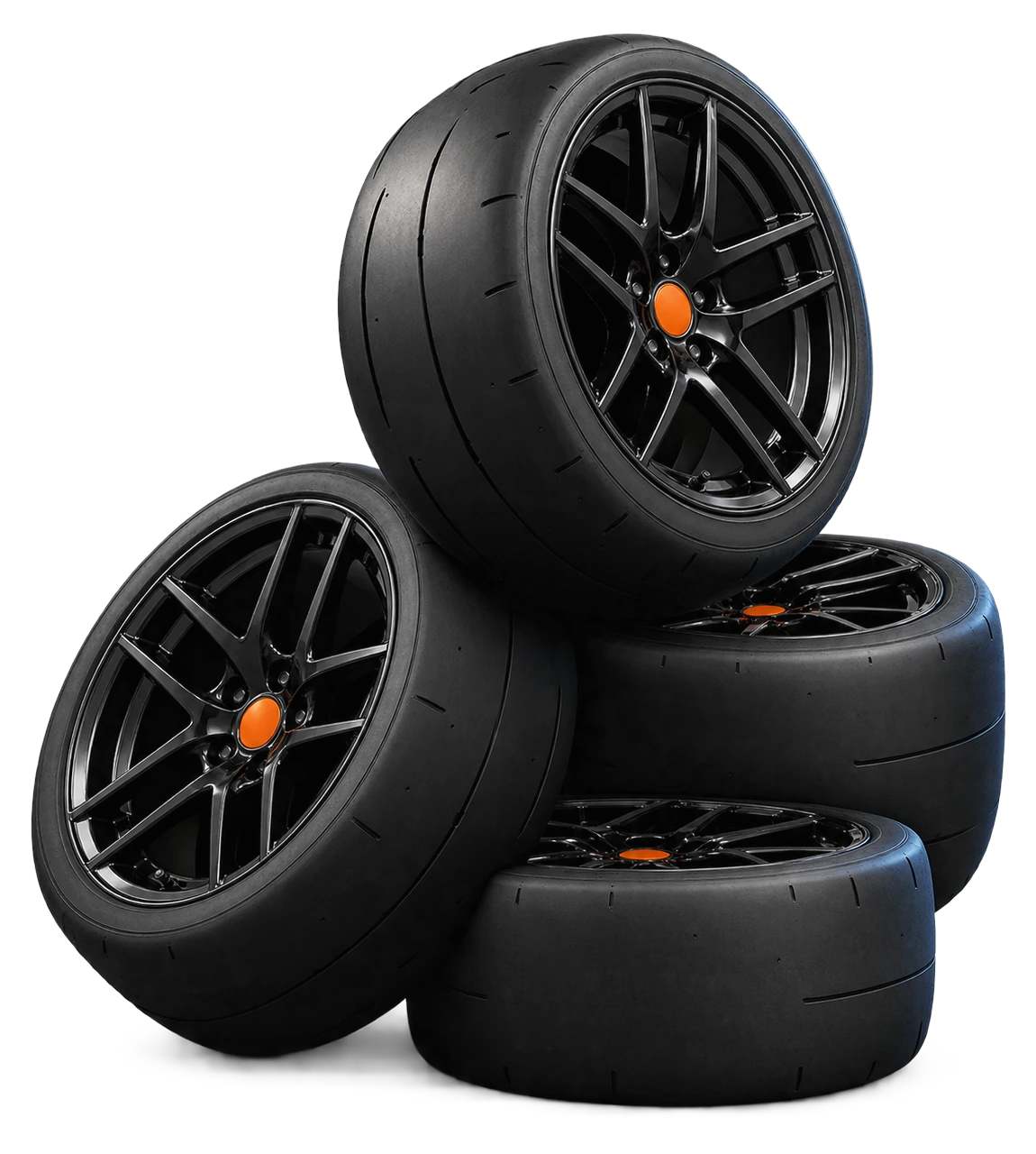 A stack of four racing slicks on a black wheel